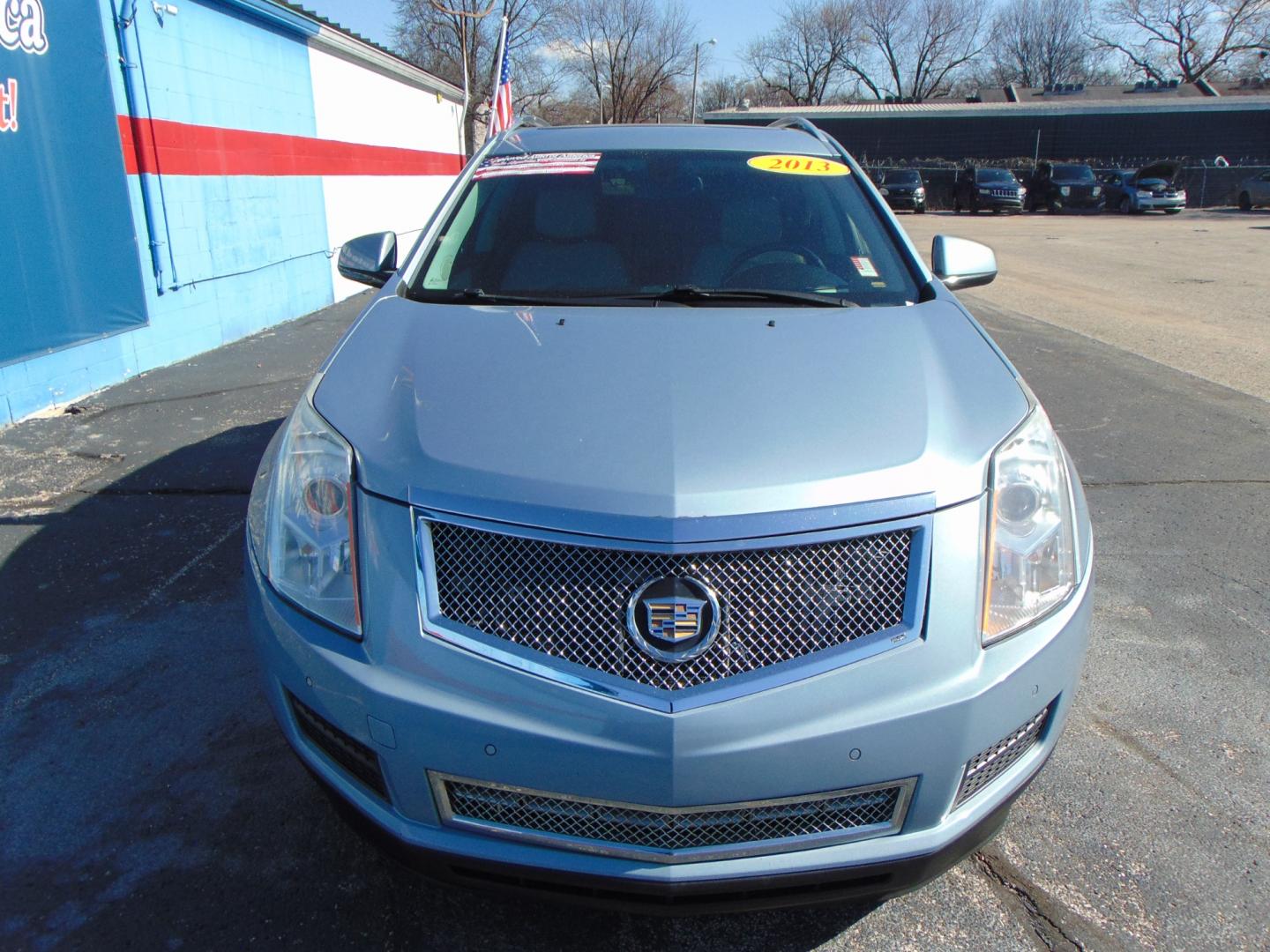 2013 Blue Cadillac SRX (3GYFNCE3XDS) with an V6 Flex Fuel 3.6 Liter engine, Auto, 6-Spd w/TAPshift transmission, located at 2105 Dixie Hwy, Louisville, KY, 40210, (502) 772-3333, 38.220932, -85.795441 - Photo#3